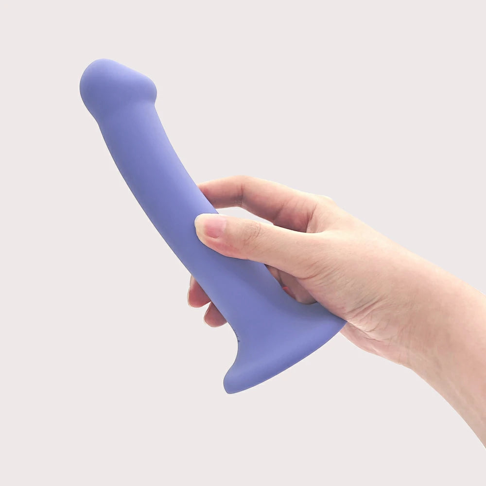 7 inch vibrating dildo holding in hand