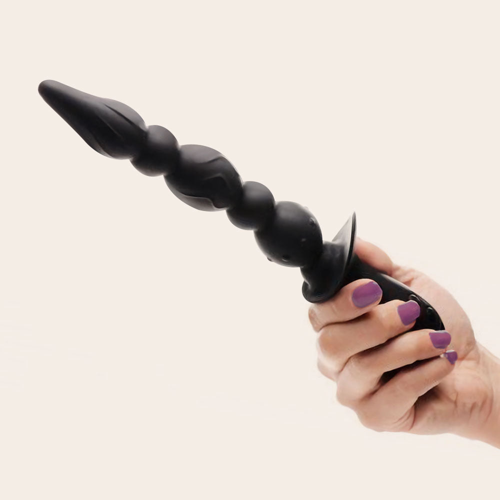 Triple motor anal beads in hand